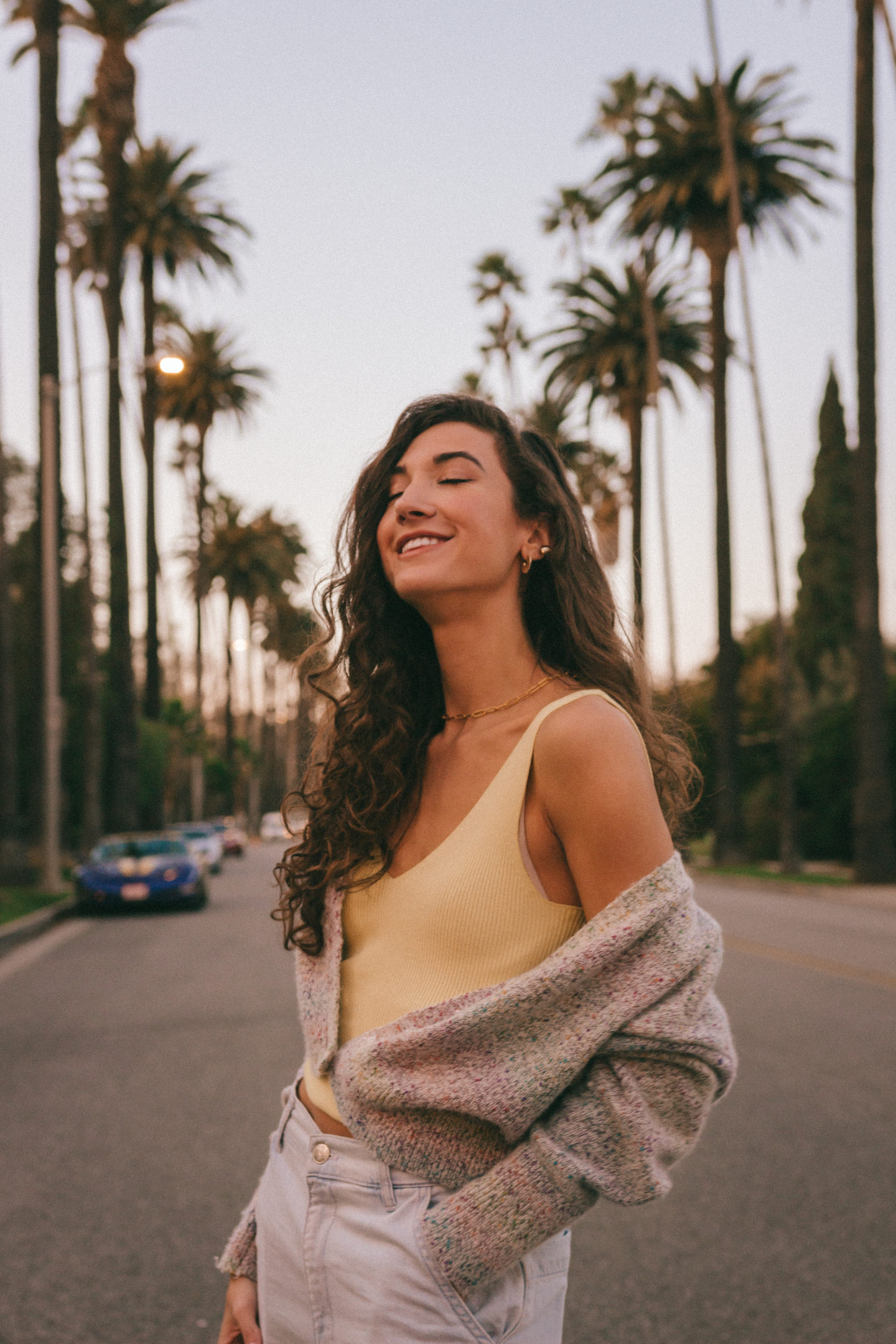 LA Outfit Recap - Knit womens fashion palm trees beverly hills california casual style curly hair inspo jeans