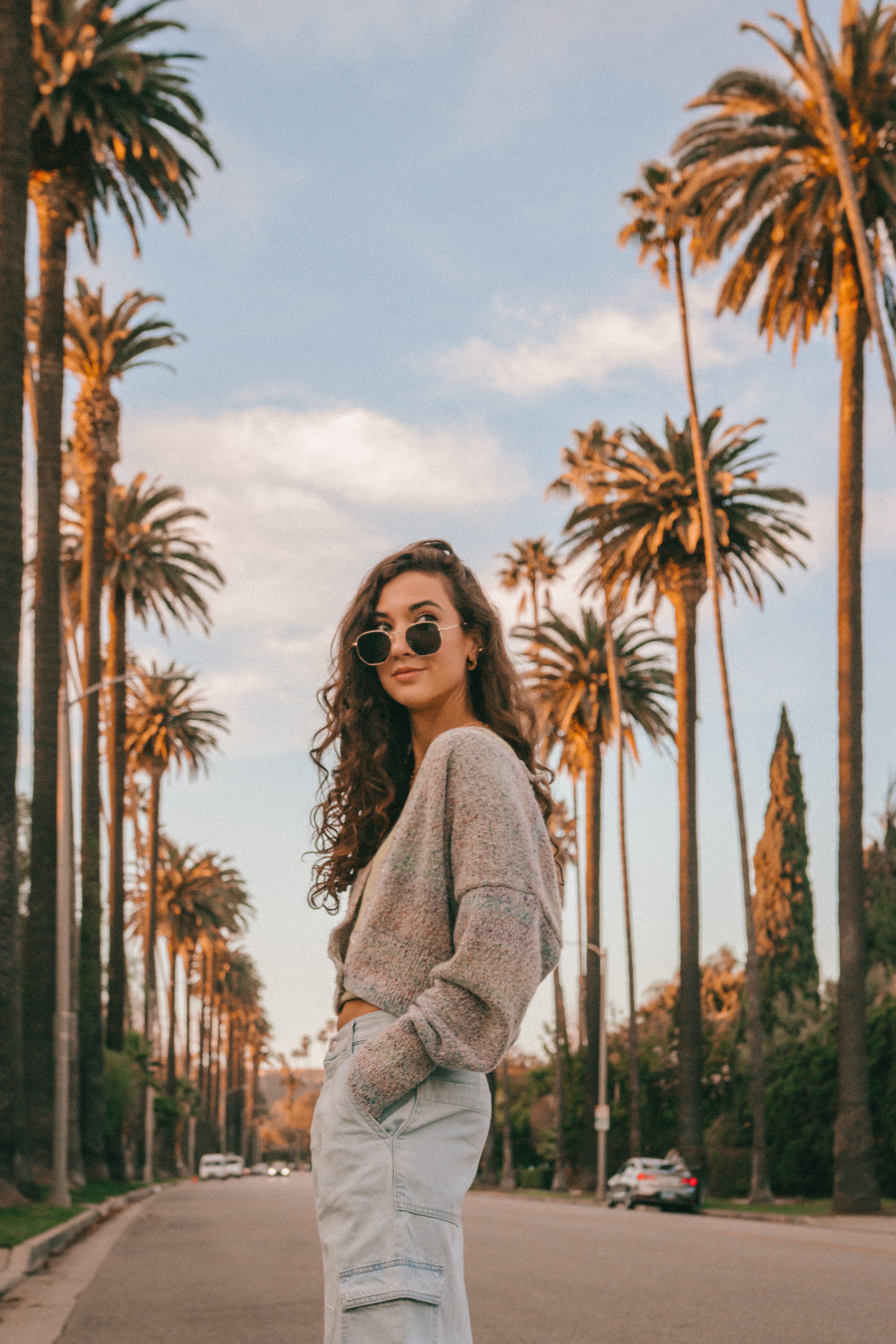 LA Outfit Recap - Knit womens fashion palm trees beverly hills california casual style curly hair inspo jeans